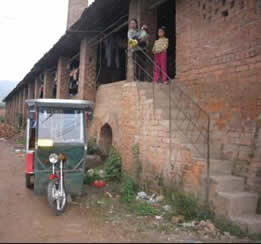 KK was in the grandma’s arms outside their home. 