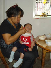 KK used to be held in arms to eat before the donation of a special chair.