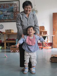 With the AFO, May learns walking using a ladder frame